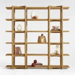 Large wooden open shelving unit with decorative objects and books displayed on multiple horizontal shelves