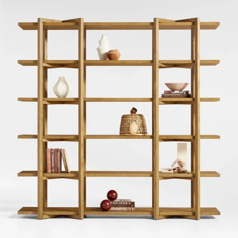 Large wooden open shelving unit with decorative objects and books displayed on multiple horizontal shelves