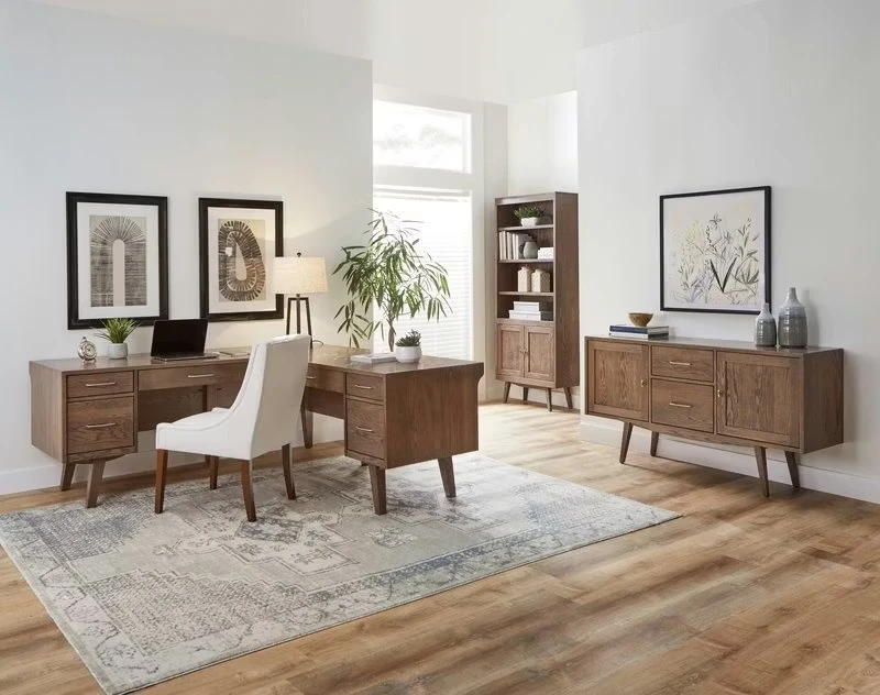 Mid century modern home office with walnut furniture, clean lines, and neutral color palette featuring desk and credenza